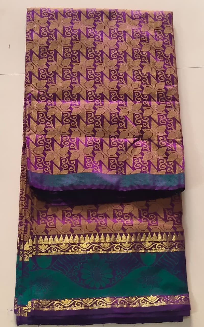 Luminous Dual-Tone Purple and Green Silk Cotton Woven Saree with Zari Motifs