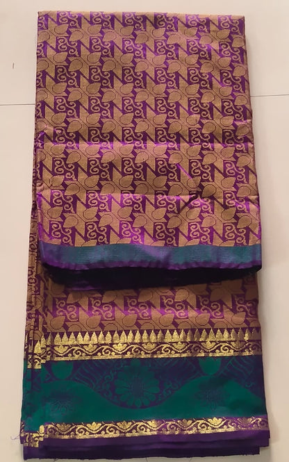 Luminous Dual-Tone Purple and Green Silk Cotton Woven Saree with Zari Motifs