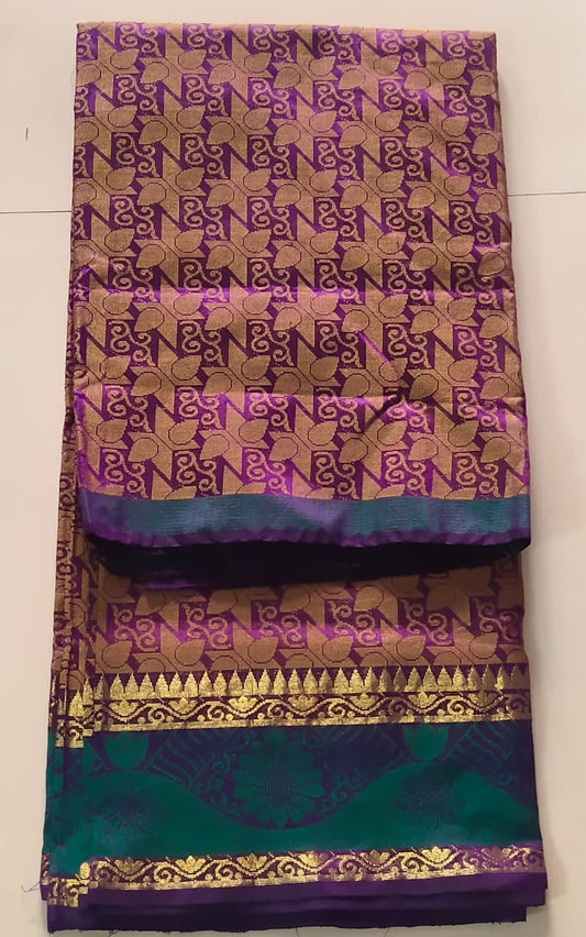 Luminous Dual-Tone Purple and Green Silk Cotton Woven Saree with Zari Motifs