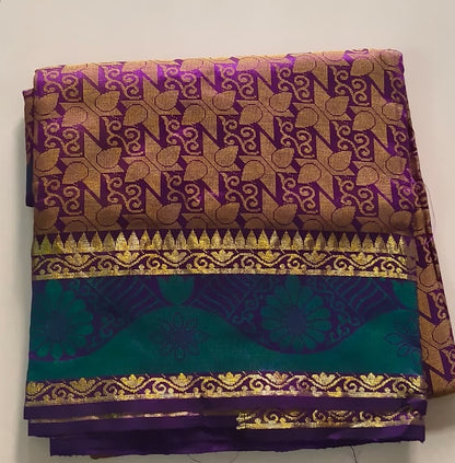 Luminous Dual-Tone Purple and Green Silk Cotton Woven Saree with Zari Motifs